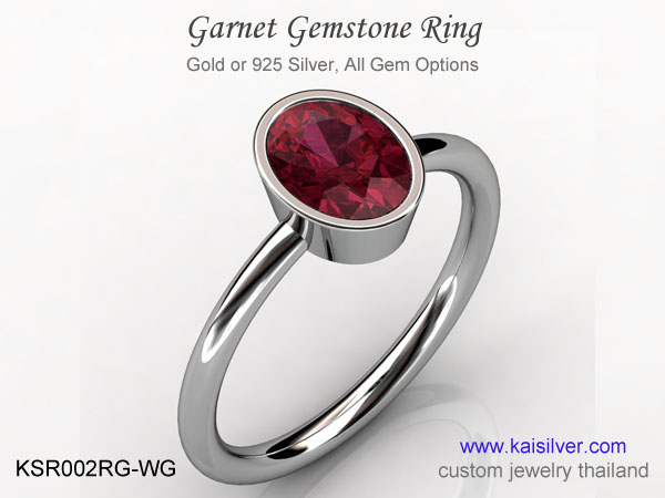 custom made gold or silver ring with oval gem